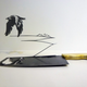 Illustration for article titled Intricate shadow silhouettes carved out of butcher's knife blades